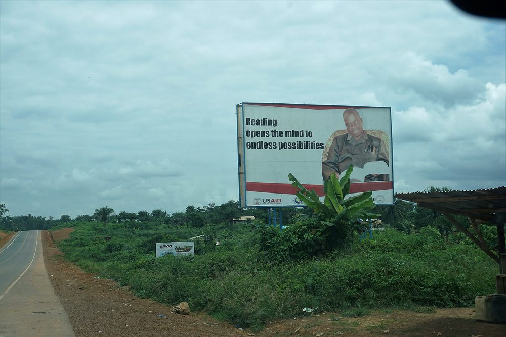 An advertising billboard on a street